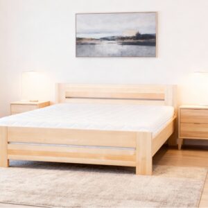 a bed with a painting on the wall